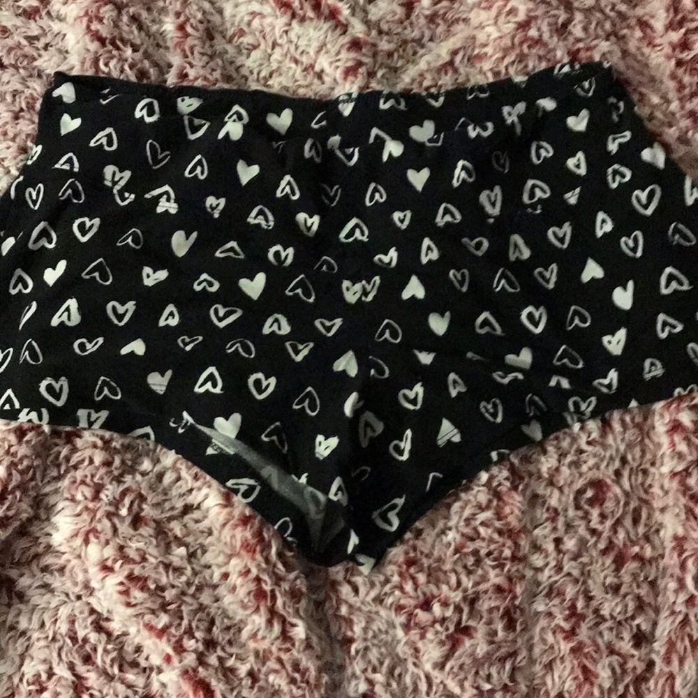 Black shorts with white hearts